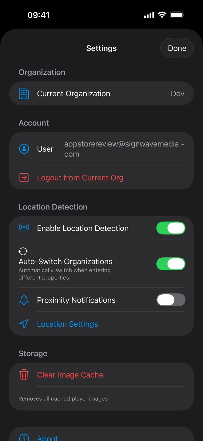 The Settings screen showing the current organization, the signed-in user, and switches for location detection, automatic organization switching and proximity notifications.